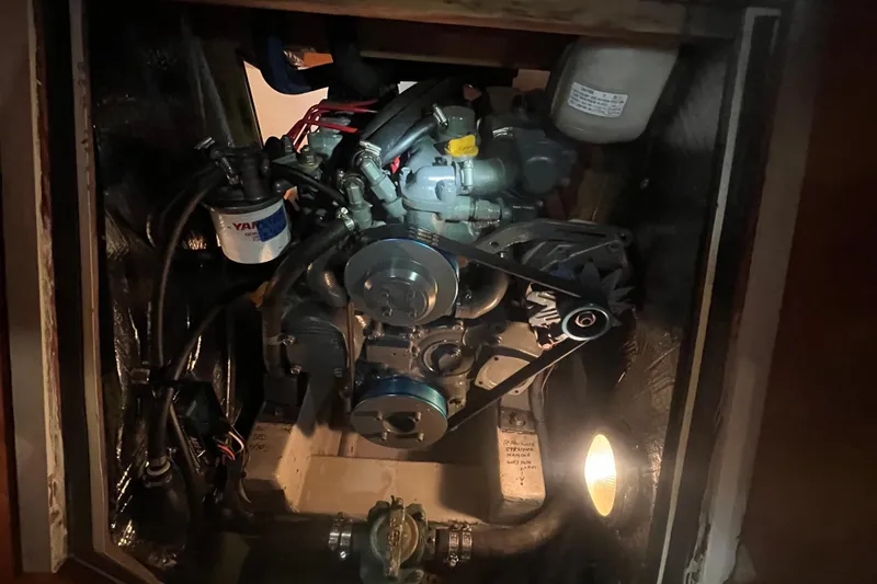Slide: The Image of Engine compartment of a 2001 Tartan 3700 Sloop, featuring a Yanmar engine. - 20