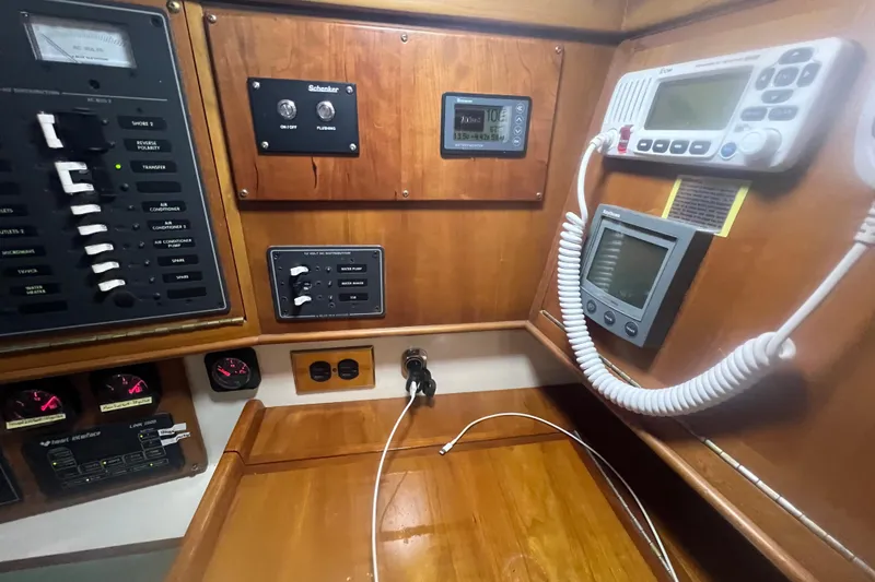 Slide: The Image of Control panel of a 2001 Tartan 3700 Sloop with navigation and communication equipment. - 8