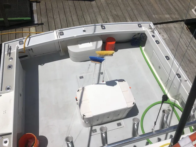 Slide: The Image of 2003 Wesmac Flybridge boat deck with fishing gear and equipment. - 13