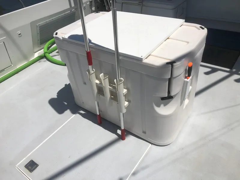 Slide: The Image of Wesmac Flybridge 2003 deck with storage box and fishing rod holders. - 20