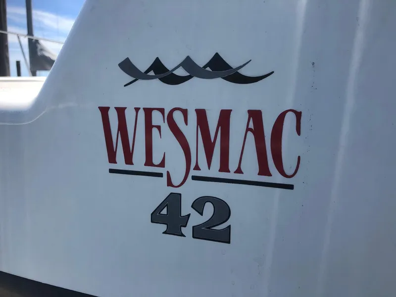 Slide: The Image of 2003 Wesmac Flybridge boat with "Wesmac 42" logo on the side. - 30