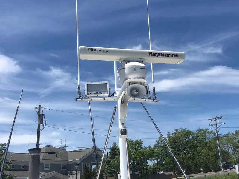 Slide: The Image of Raymarine radar on 2003 Wesmac Flybridge against a clear blue sky. - 35
