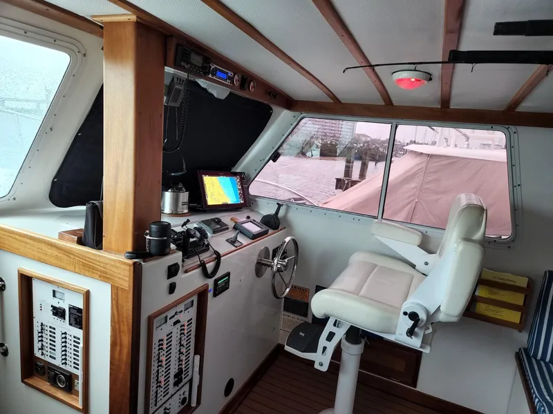 Slide: The Image of 2003 Wesmac Flybridge helm with navigation equipment and captain's chair. - 40