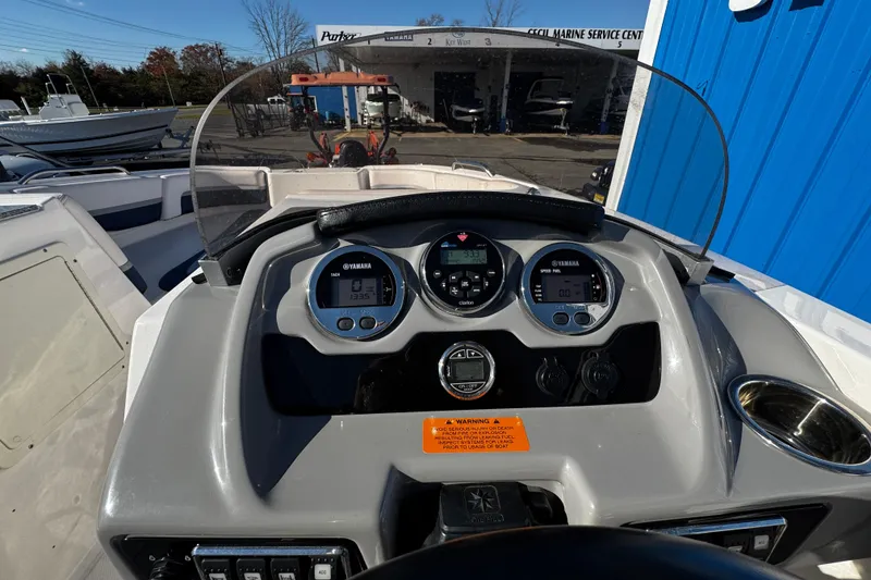 Slide: The Image of 2019 Chaparral 191 Suncoast boat dashboard with Yamaha gauges and controls. - 10