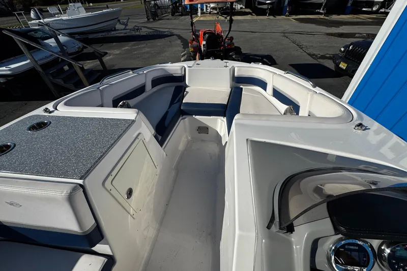 Slide: The Image of 2019 Chaparral 191 Suncoast boat interior with seating and dashboard view. - 11