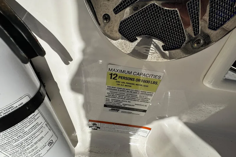 Slide: The Image of 2019 Chaparral 191 Suncoast boat capacity label, maximum 12 persons or 1600 lbs. - 17