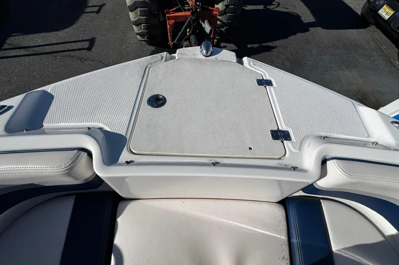 Slide: The Image of 2019 Chaparral 191 Suncoast boat deck with storage compartment and seating. - 22