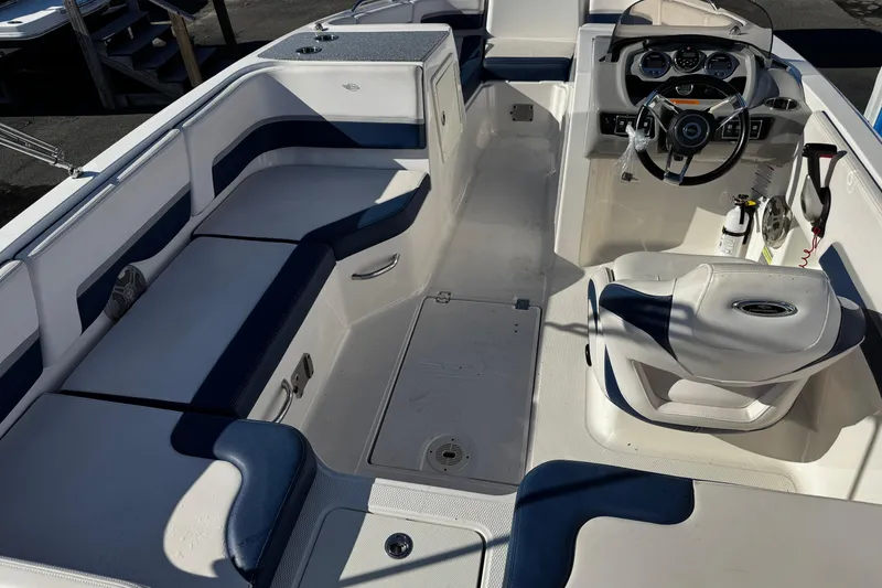 Slide: The Image of 2019 Chaparral 191 Suncoast boat interior with seating and steering console. - 24