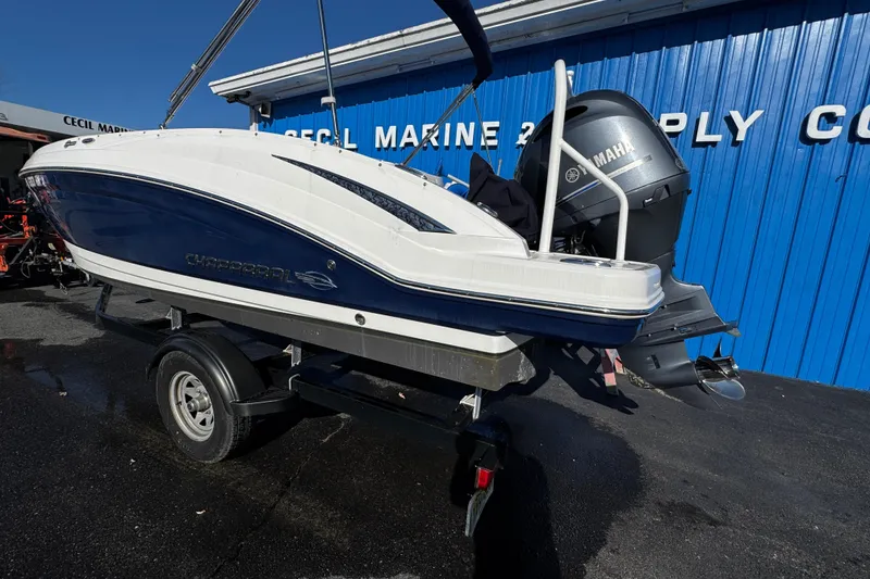 Slide: The Image of 2019 Chaparral 191 Suncoast boat on trailer, blue and white, Yamaha engine. - 27
