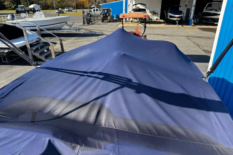 Slide: The Image of Covered 2019 Chaparral 191 Suncoast boat in a marina setting. - 29