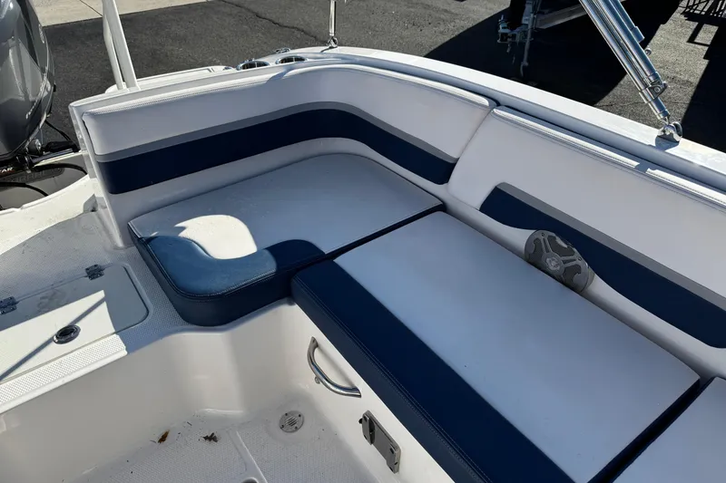 Slide: The Image of 2019 Chaparral 191 Suncoast boat interior with blue and white seating. - 5