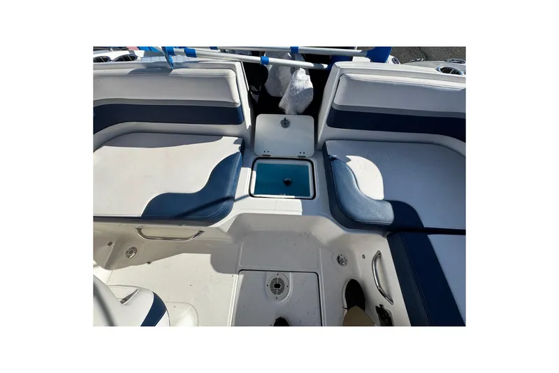 Slide: The Image of 2019 Chaparral 191 Suncoast boat interior with seating and storage compartments. - 7