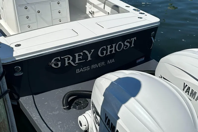 Slide: The Image of 2023 Regulator 34 boat named "Grey Ghost" docked at Bass River, MA. - 11