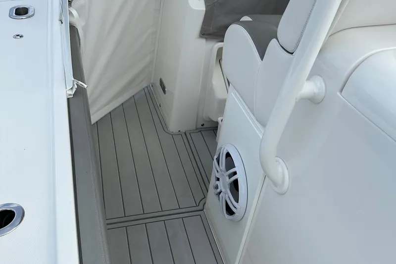 Slide: The Image of 2023 Regulator 34 boat interior with sleek seating and modern speaker system. - 15