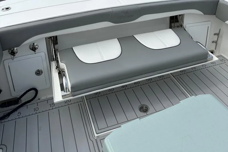 Slide: The Image of 2023 Regulator 34 boat with foldable bench seat and deck ruler. - 17