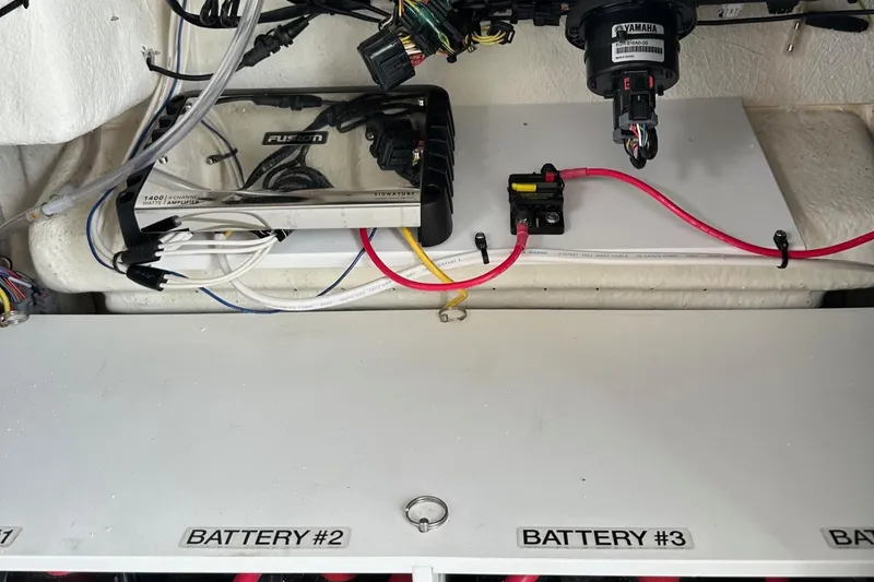 Slide: The Image of Electrical system of 2023 Regulator 34 boat with labeled battery compartments. - 26
