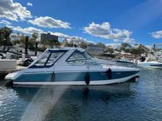 The Image of 2005 Formula 330 Sun Sport boat docked in a marina on a sunny day. - 0