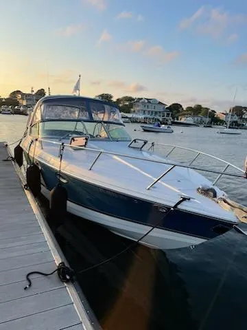 Slide: The Image of 2005 Formula 330 Sun Sport docked at a marina during sunset. - 1