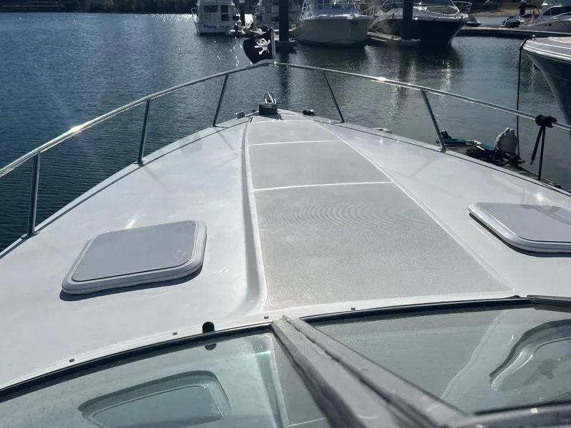 Slide: The Image of 2005 Formula 330 Sun Sport boat docked at a marina. - 10