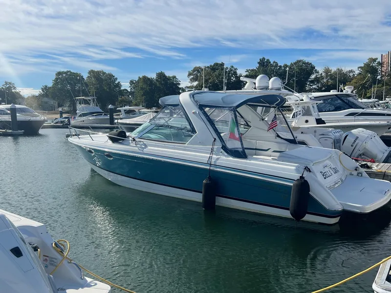 Slide: The Image of 2005 Formula 330 Sun Sport boat docked in a marina. - 2