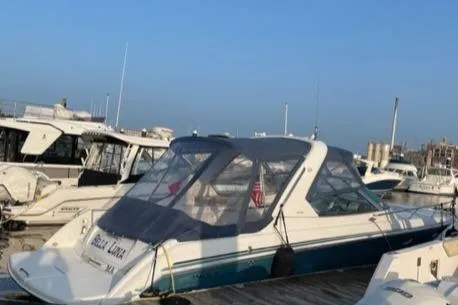 Slide: The Image of 2005 Formula 330 Sun Sport boat docked at a marina. - 4