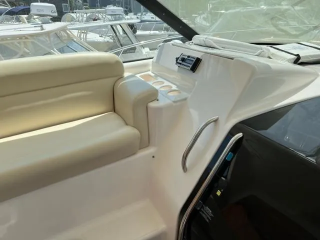 Slide: The Image of 2008 Tiara Yachts 3900 Sovran interior seating and control panel. - 14