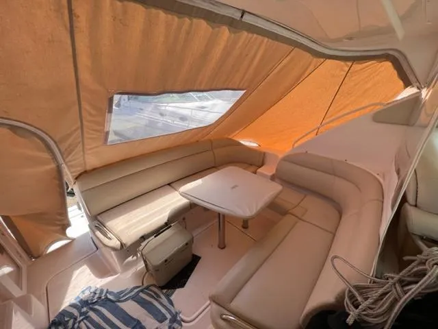 Slide: The Image of 2008 Tiara Yachts 3900 Sovran interior with beige seating and table. - 15