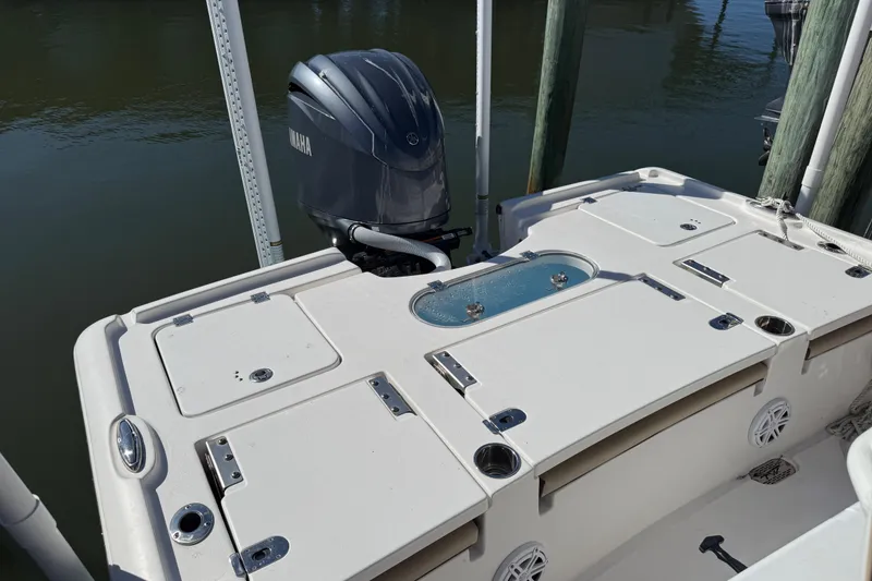 Slide: The Image of 2022 Tidewater 2500 Carolina Bay boat with Yamaha outboard motor, docked by the water. - 10