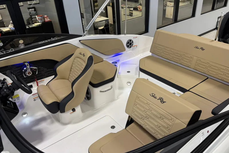 Slide: The Image of 2026 Sea Ray SPX 210 Outboard boat interior with tan seating and modern dashboard. - 10