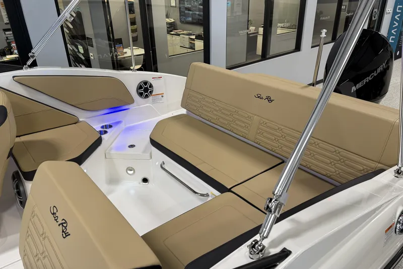 Slide: The Image of 2026 Sea Ray SPX 210 Outboard boat interior with tan seating and modern design. - 12
