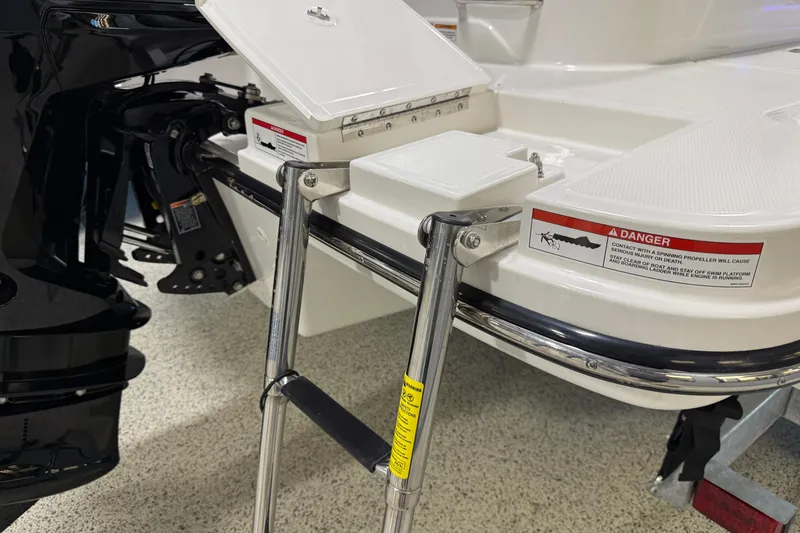 Slide: The Image of 2026 Sea Ray SPX 210 Outboard boat with swim platform and ladder. - 16