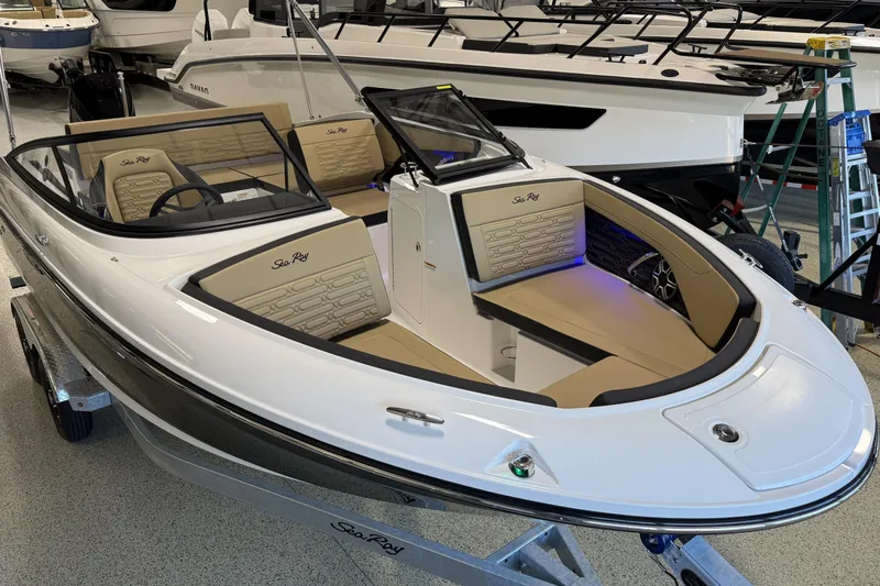 Slide: The Image of 2026 Sea Ray SPX 210 Outboard boat with sleek design and luxurious interior. - 18