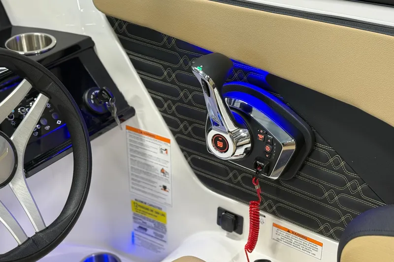 Slide: The Image of 2026 Sea Ray SPX 210 Outboard boat interior with steering wheel and control panel. - 34