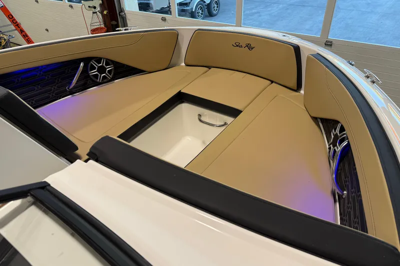 Slide: The Image of 2026 Sea Ray SPX 210 Outboard boat interior with tan seating and modern design. - 36