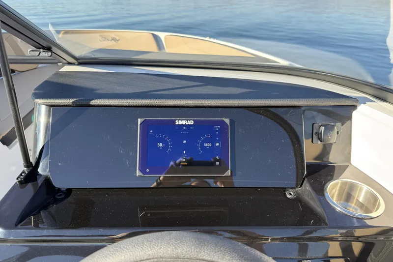 Slide: The Image of 2026 Sea Ray SPX 210 Outboard boat on display in showroom. - 6