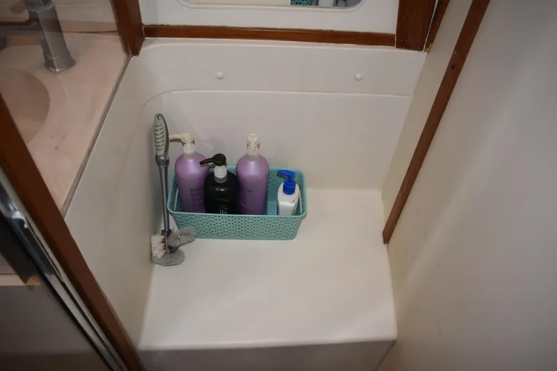 Slide: The Image of Bathroom corner with toiletries in a Mainship 390, 2001 model. - 34
