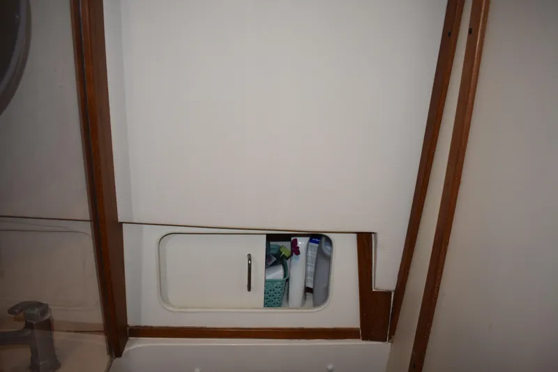 Slide: The Image of 2001 Mainship 390 interior storage compartment with toiletries. - 35