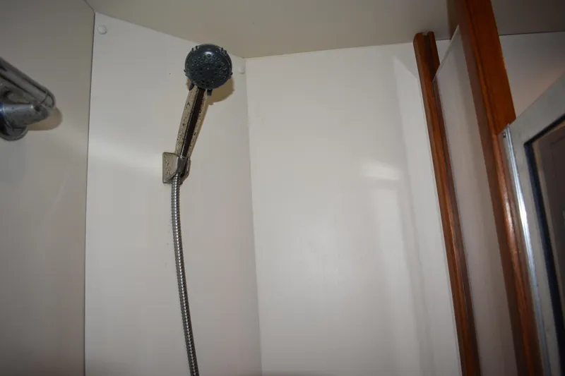 Slide: The Image of Shower area in 2001 Mainship 390 boat with handheld showerhead. - 37
