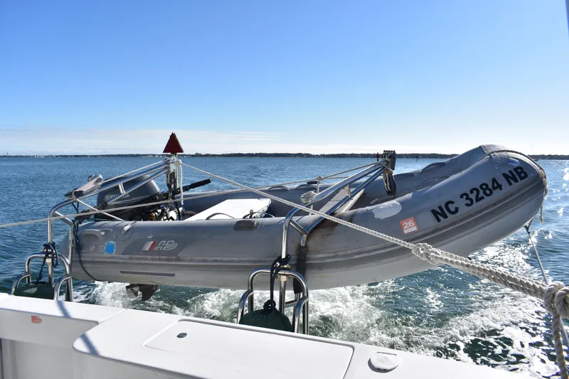 Slide: The Image of Inflatable boat on Mainship 390, 2001 model, cruising on open water. - 53