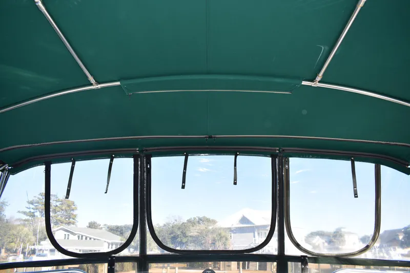 Slide: The Image of Interior view of 2001 Mainship 390 boat canopy with clear windows. - 70