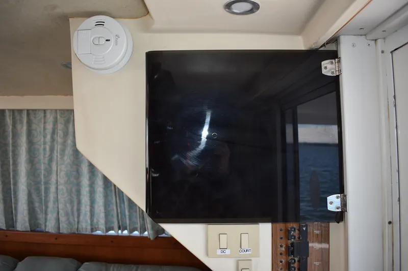 Slide: The Image of Interior of 2001 Mainship 390 boat with control panel and smoke detector. - 72