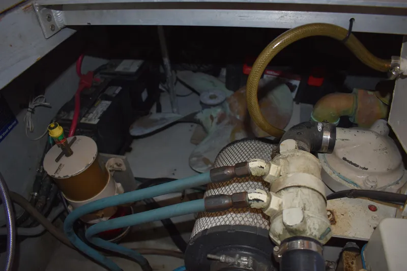 Slide: The Image of Engine room of 2001 Mainship 390 with visible components and wiring. - 78