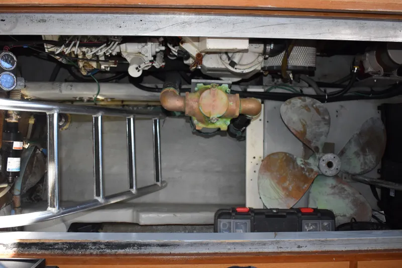 Slide: The Image of Engine room of 2001 Mainship 390 with ladder, gauges, and propeller. - 79