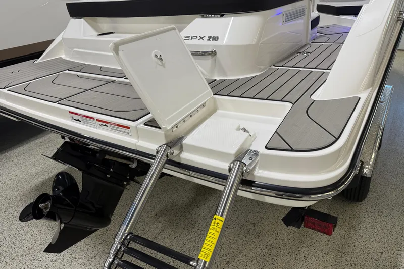 Slide: The Image of 2026 Sea Ray SPX 210 boat with swim platform and ladder. - 13