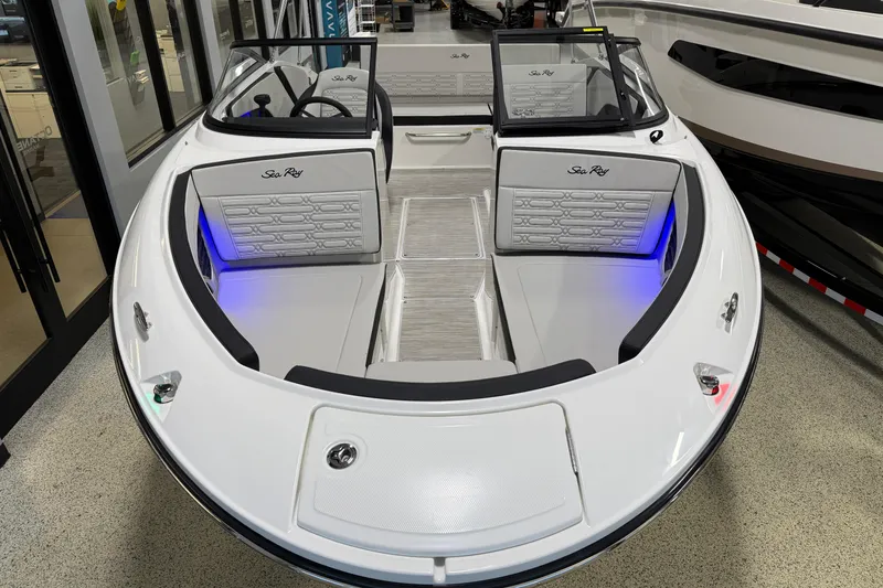 Slide: The Image of 2026 Sea Ray SPX 210 boat interior with modern seating and ambient lighting. - 17