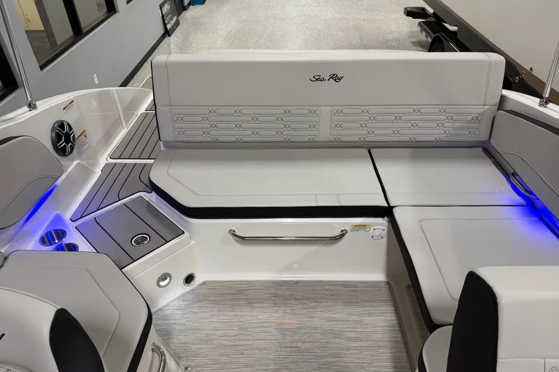 Slide: The Image of 2026 Sea Ray SPX 210 boat interior with sleek seating and ambient lighting. - 21