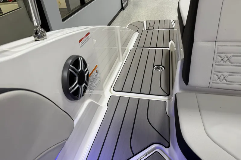 Slide: The Image of 2026 Sea Ray SPX 210 boat interior with sleek seating and modern speaker system. - 25