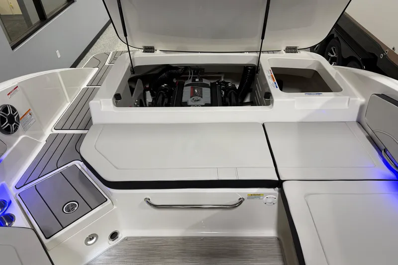 Slide: The Image of 2026 Sea Ray SPX 210 boat engine compartment with open hatch, showcasing modern design. - 29