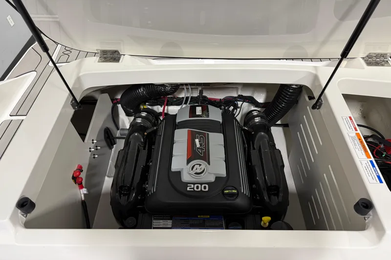 Slide: The Image of 2026 Sea Ray SPX 210 engine compartment showcasing a powerful 200 horsepower engine. - 30