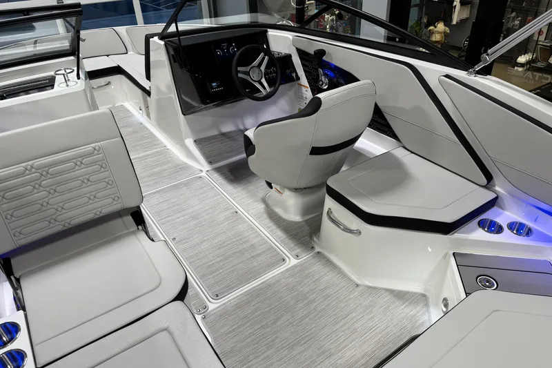 Slide: The Image of Luxurious interior of 2026 Sea Ray SPX 210 boat with modern seating and controls. - 35